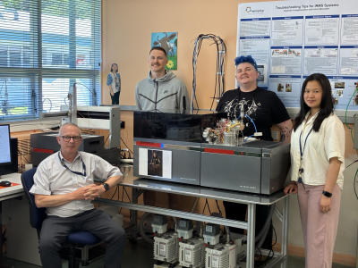 Earth Sciences staff Andy Phillips, Joanna Yang, Tyler Heath, Rebekah Hines and Phoebe Tio stand next to a new piece of equipment.