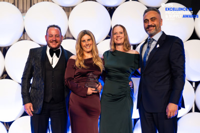 Tod Cooper, Emma Morrow, Charlotte Payne, and Conan Manaena in formal wear standing together smiling.
